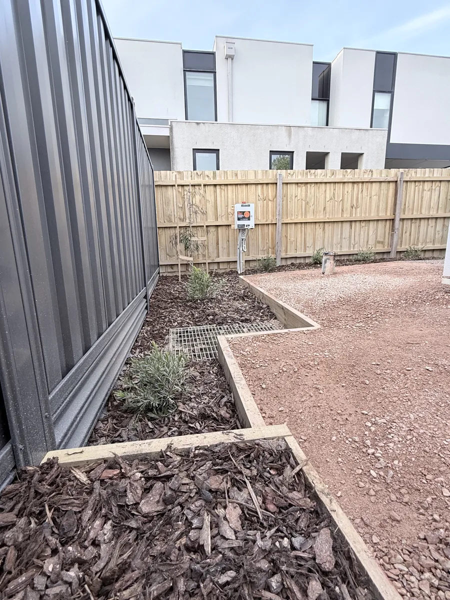 Timber boundary fence and courtyard