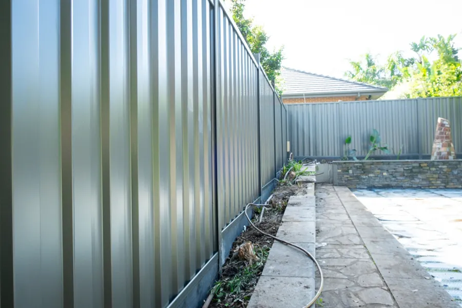Colorbond side boundary with paving