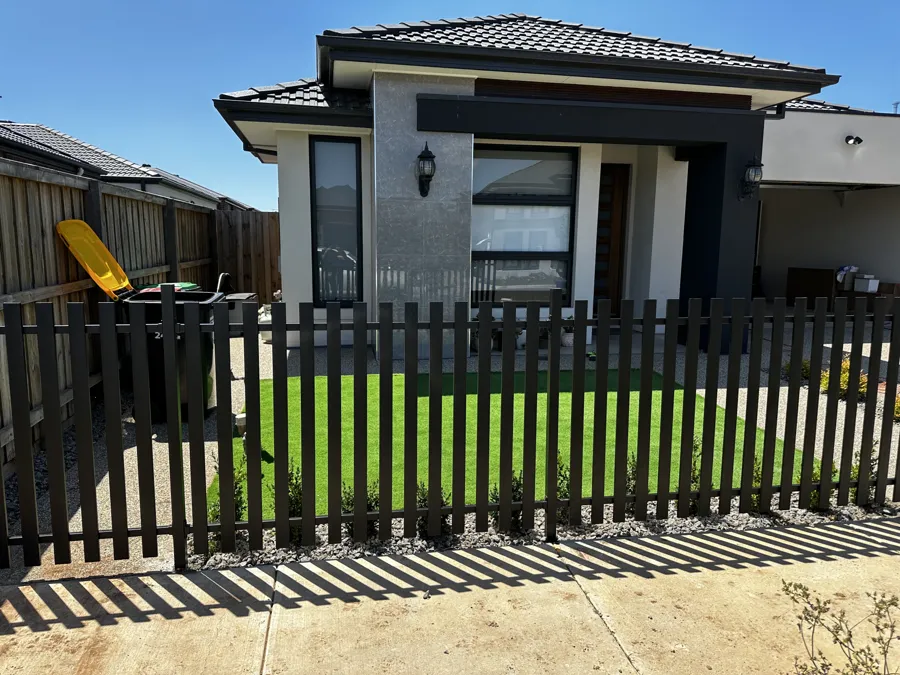 Black slat front fence