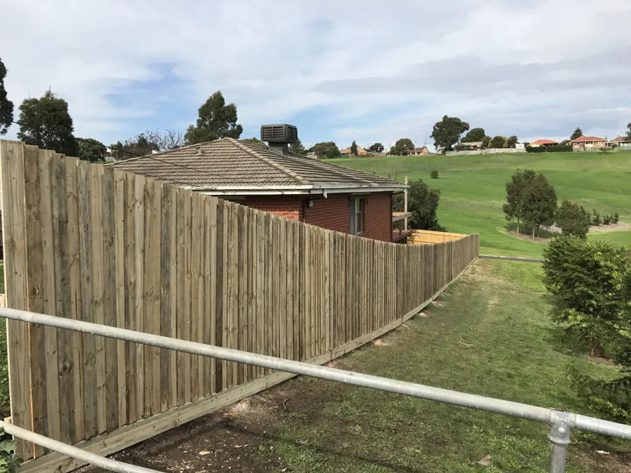 Long timber fence on a large block