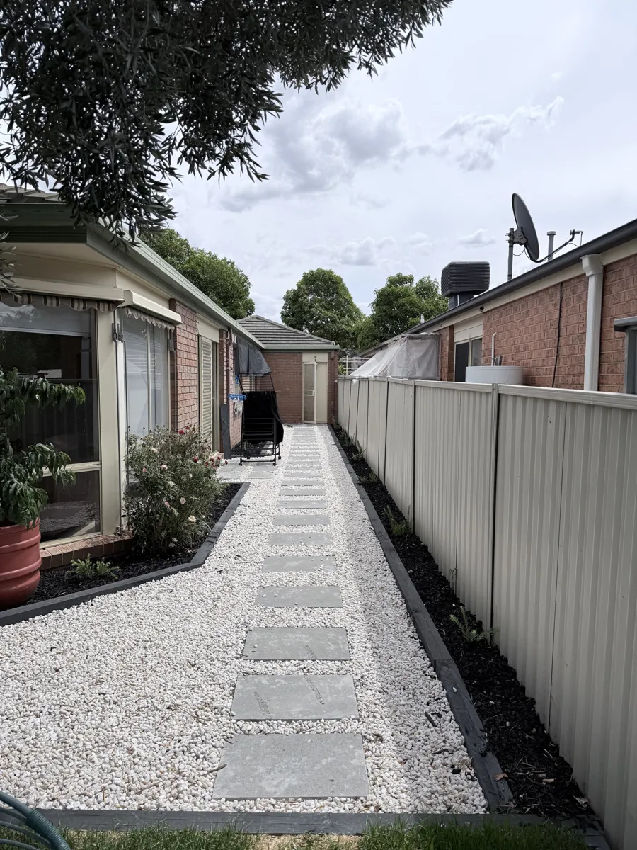 Stepping-stone path with edged garden beds