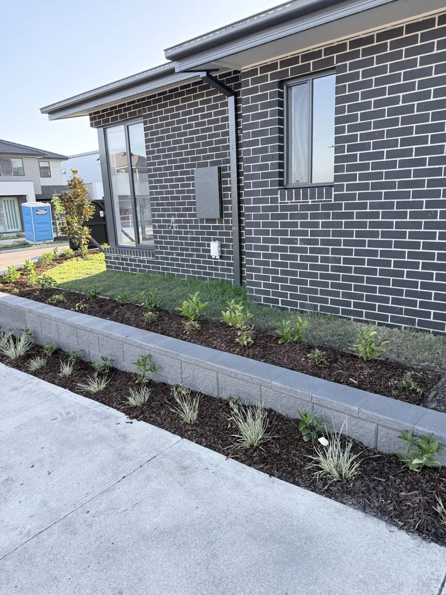 Block garden wall along the house